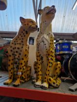 Two resin cheetah animal figures, height 73cm and 56cm.