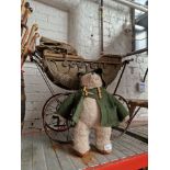 A paddington bear & a vintage pram