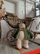 A paddington bear & a vintage pram