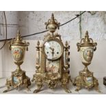 A German mantle clock and garnitures.