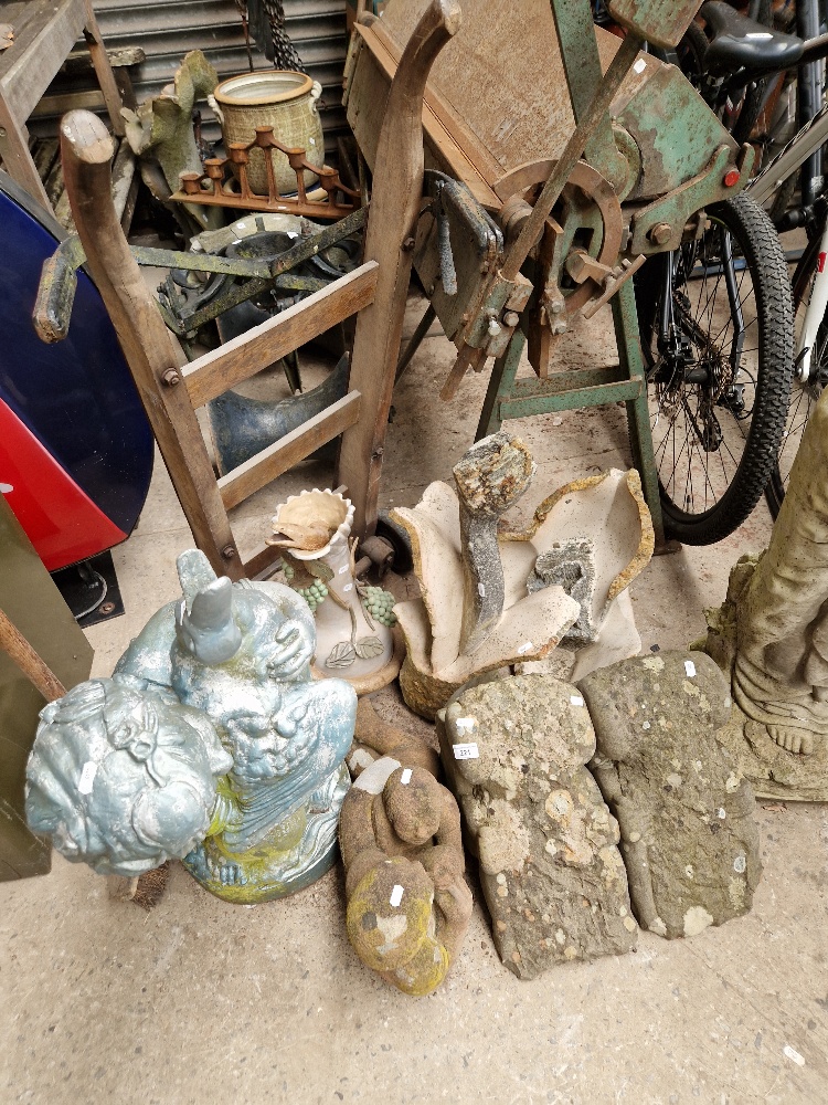 Garden statuary comprising a pair of corbels, flower, ewer, and two figures.