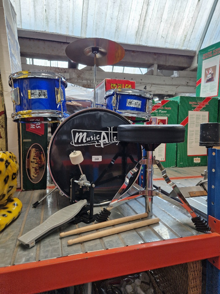 A child's Music Alley drum kit, with seat.