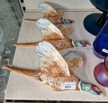 A set of three Beswick flying pheasants.