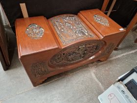 An Eastern carved camphor wood chest.