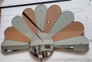 A 1930s Art Deco wall mirror with peach glass panels, 104cm x 68cm.