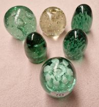 Six green glass Victorian paperweights