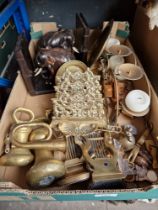 A box of assorted mainly brass ware including weights and a letter rack.