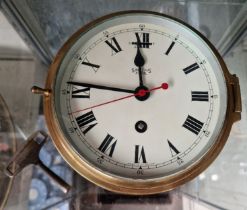 A Smiths brass bulkhead clock, 6" diameter dial.