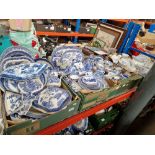 Four boxes of assorted blue and white pottery.