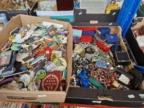 A boxed of mixed costume jewellery, badges and magnets.