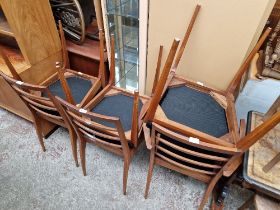 A set of six mid 20th century teak dining chairs including two carvers.