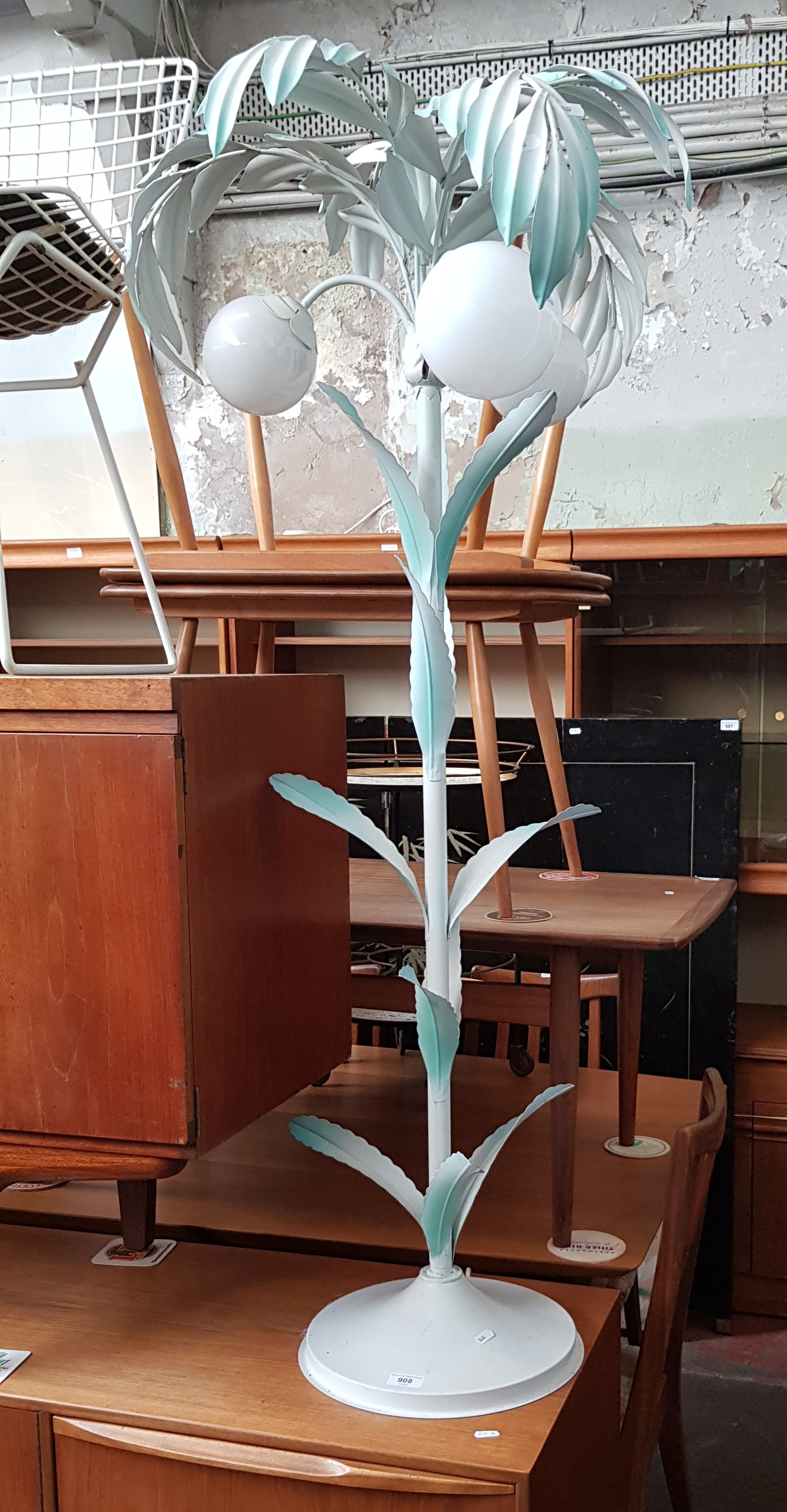 A metal floor standing lamp modelled as a palm tree.