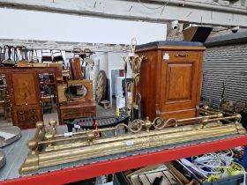 Two brass fire fenders, a walnut coal scuttle, fire crate, and a fire companion set.