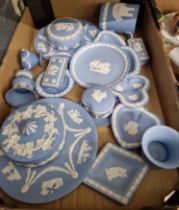 A box of blue and white Wedgwood jasperware.