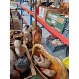 A collection of mainly carved wooden animal figures and a witch.