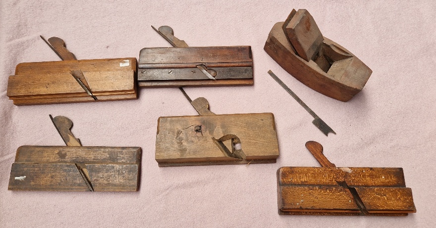 Six woodworking hand planes.