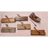 Six woodworking hand planes.