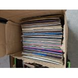 A box of assorted records.