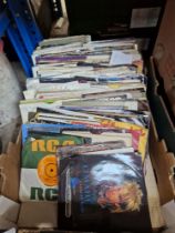 A box of vinyl 7" singles, mostly pop including Elvis, Blondie, Rolling Stones, Ultravox, Madness,