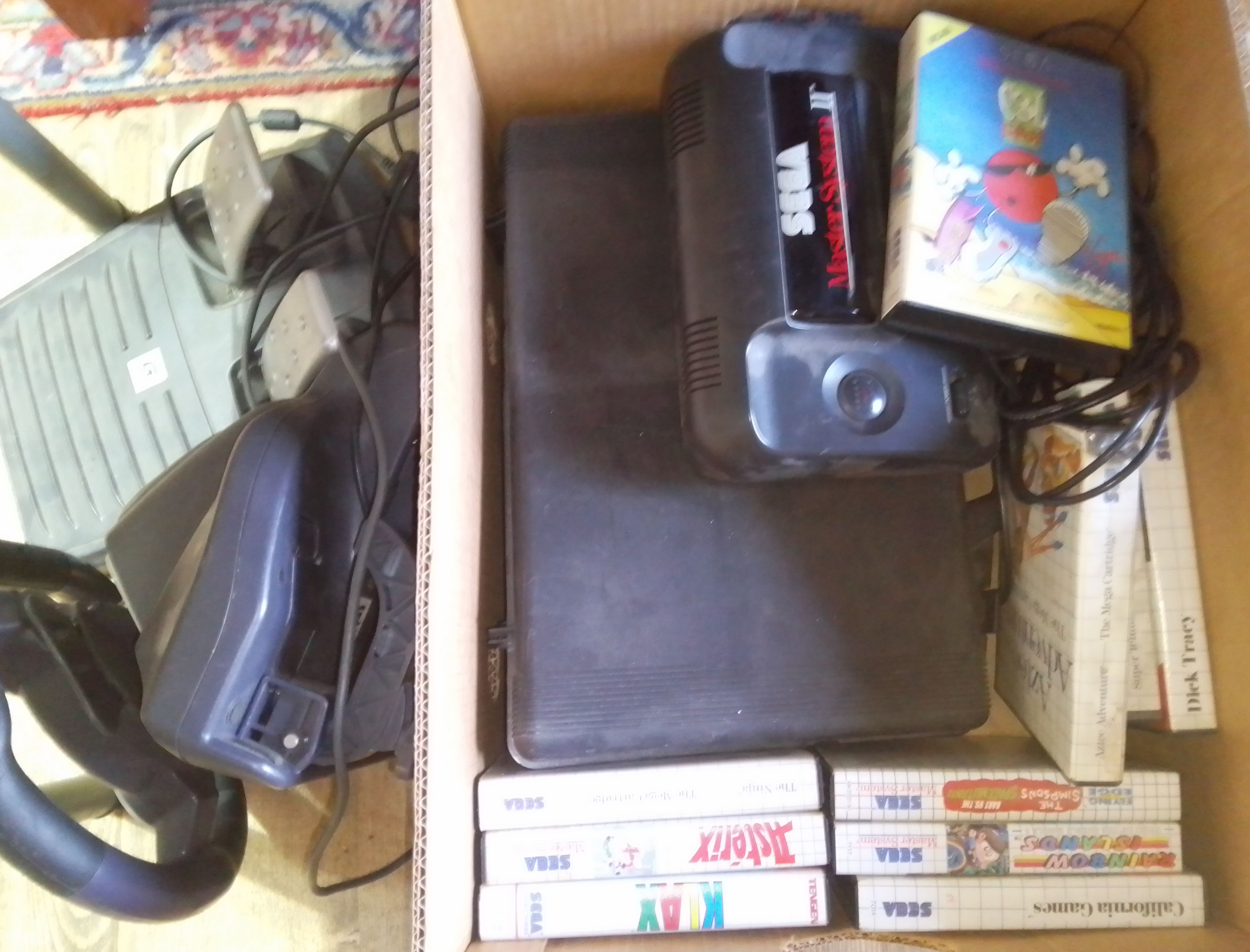 A Sega Master System II with games and accessories.