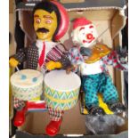 Two Japanese Alps mechanical tinplate toys comprising of a seated Mexican drummer & a seated clown