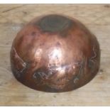 A Newlyn style Arts & Crafts copper bowl decorated with fish, diameter 15cm.