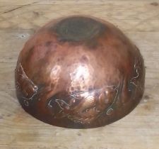 A Newlyn style Arts & Crafts copper bowl decorated with fish, diameter 15cm.