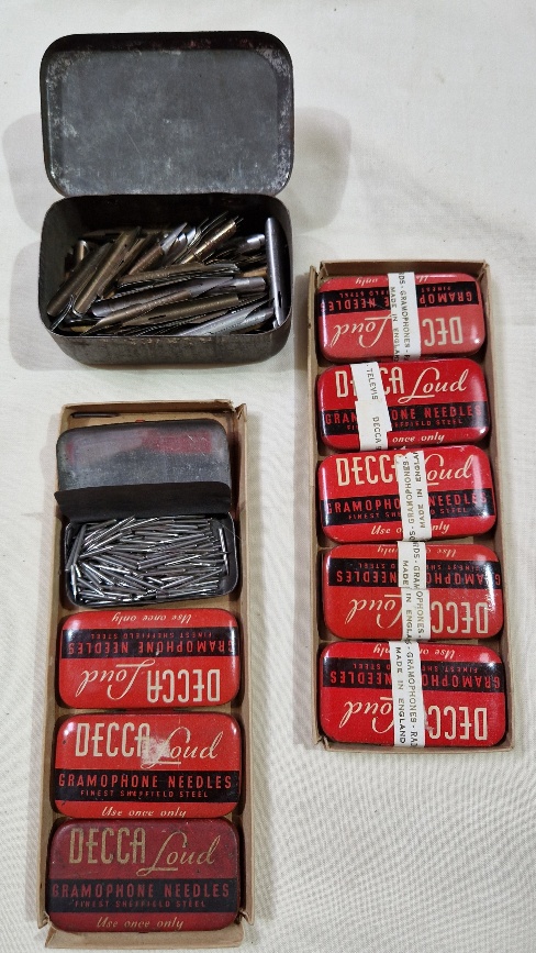 Nine tins of Decca Loud gramophone needles and a tin of pen nibs.