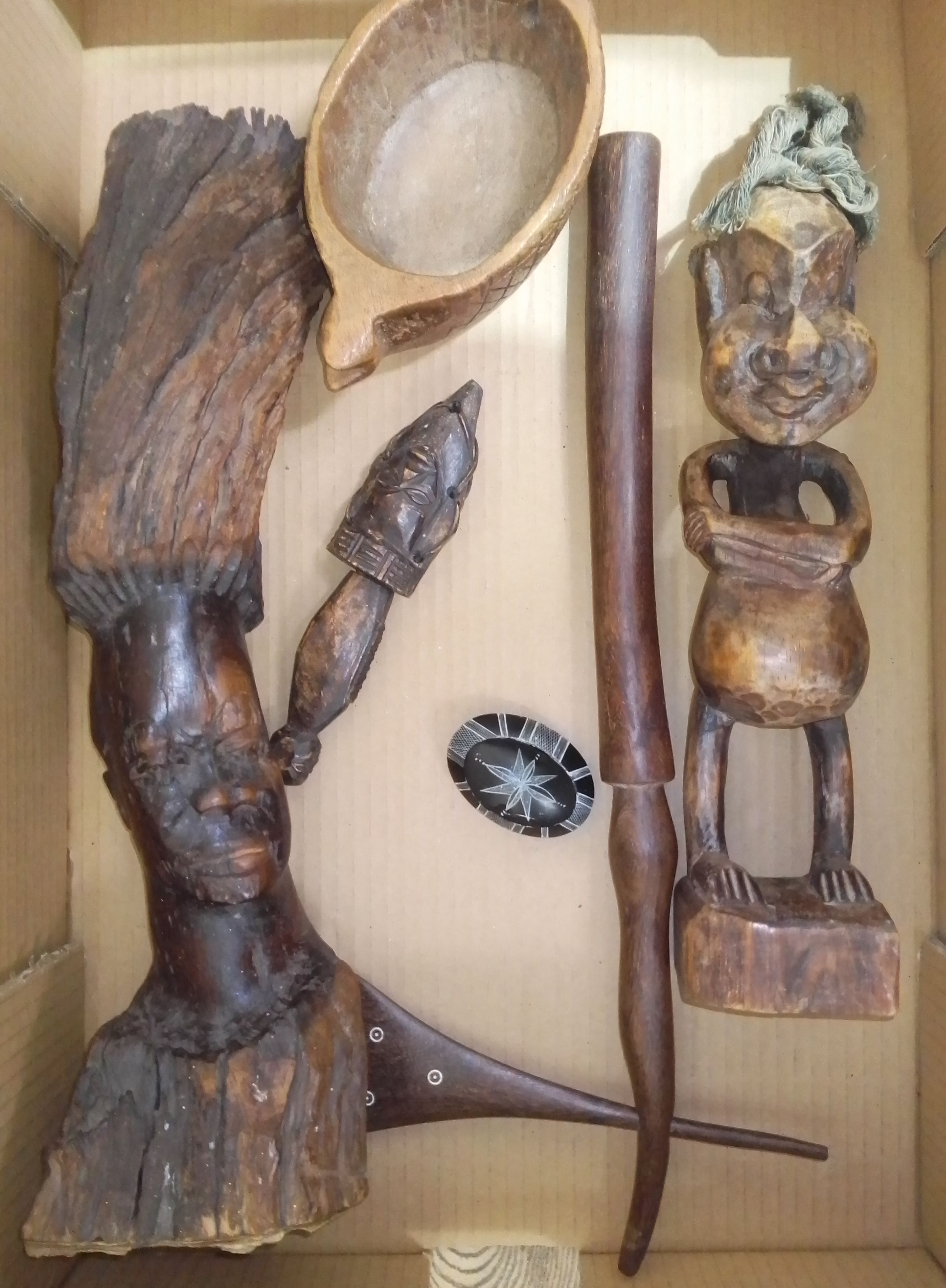A box of assorted African items incl two figures one from a root carving