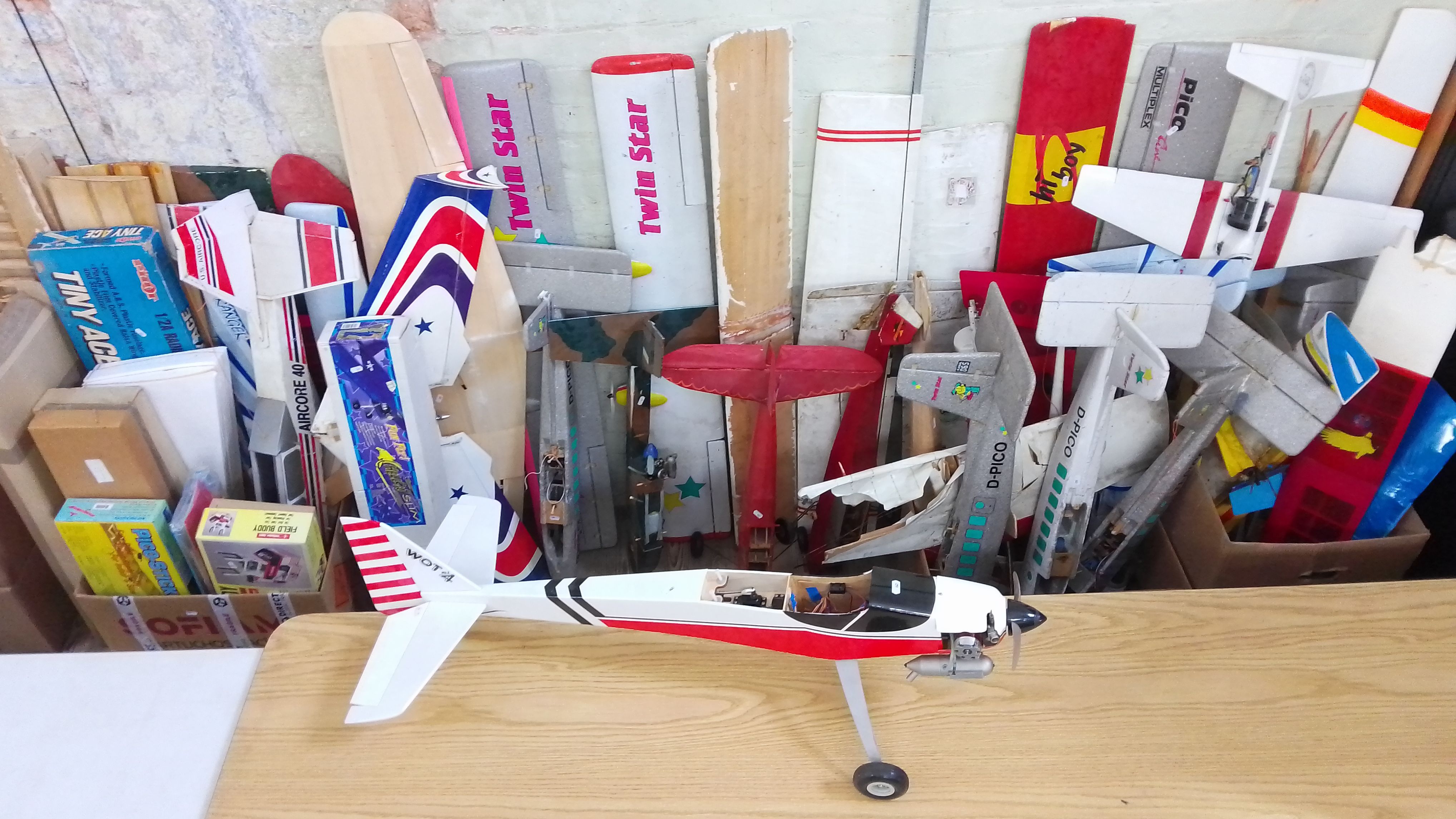 A large quantity of mainly radio controlled aeroplanes, mainly parts, including engines, a part