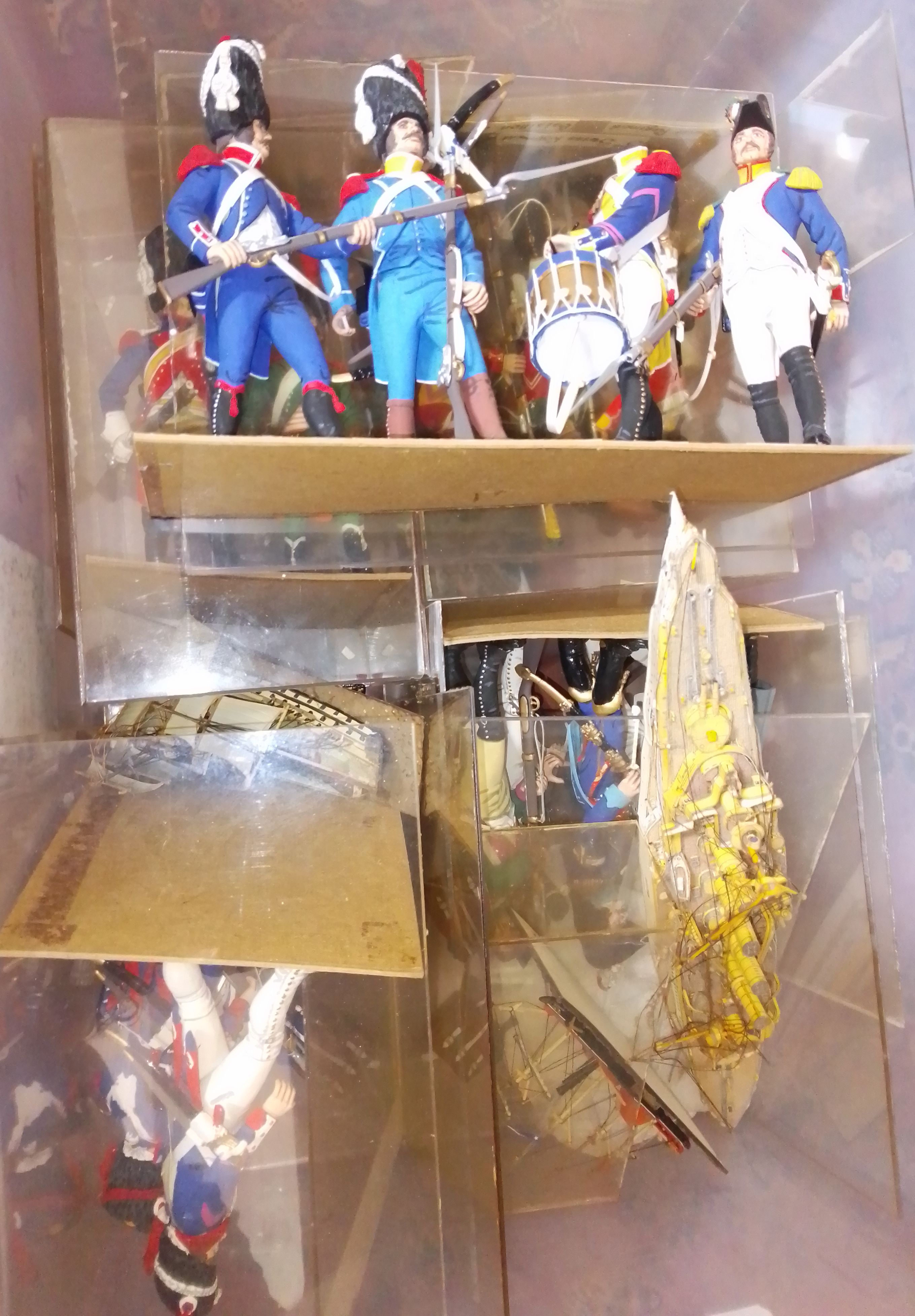 four boxes of military figure dioramas.