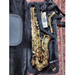 An Artemis brass alto saxophone, model AL89049, serial no.321091, with accessories and case.
