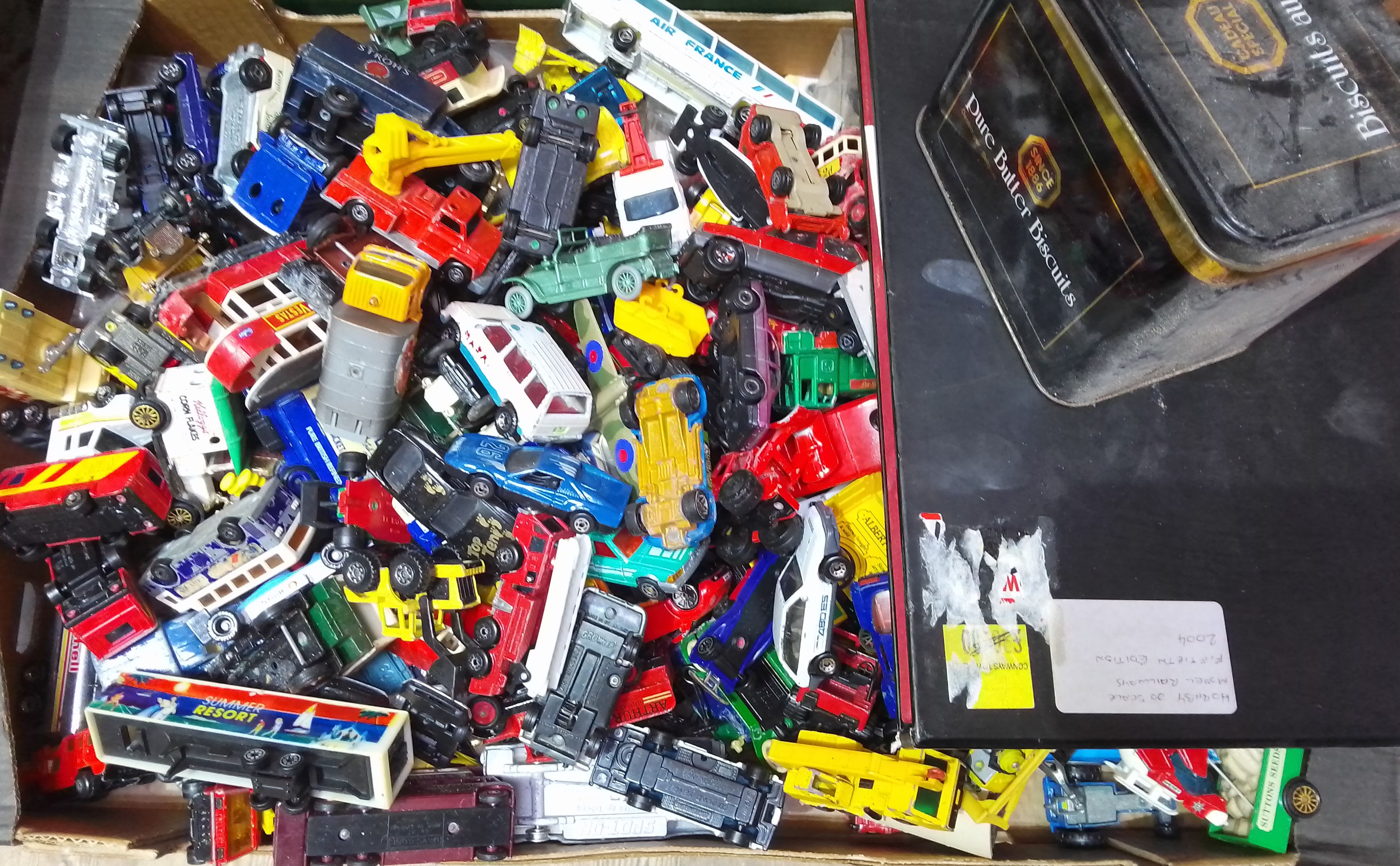 A box of assorted diecast toys & a Hornby book.