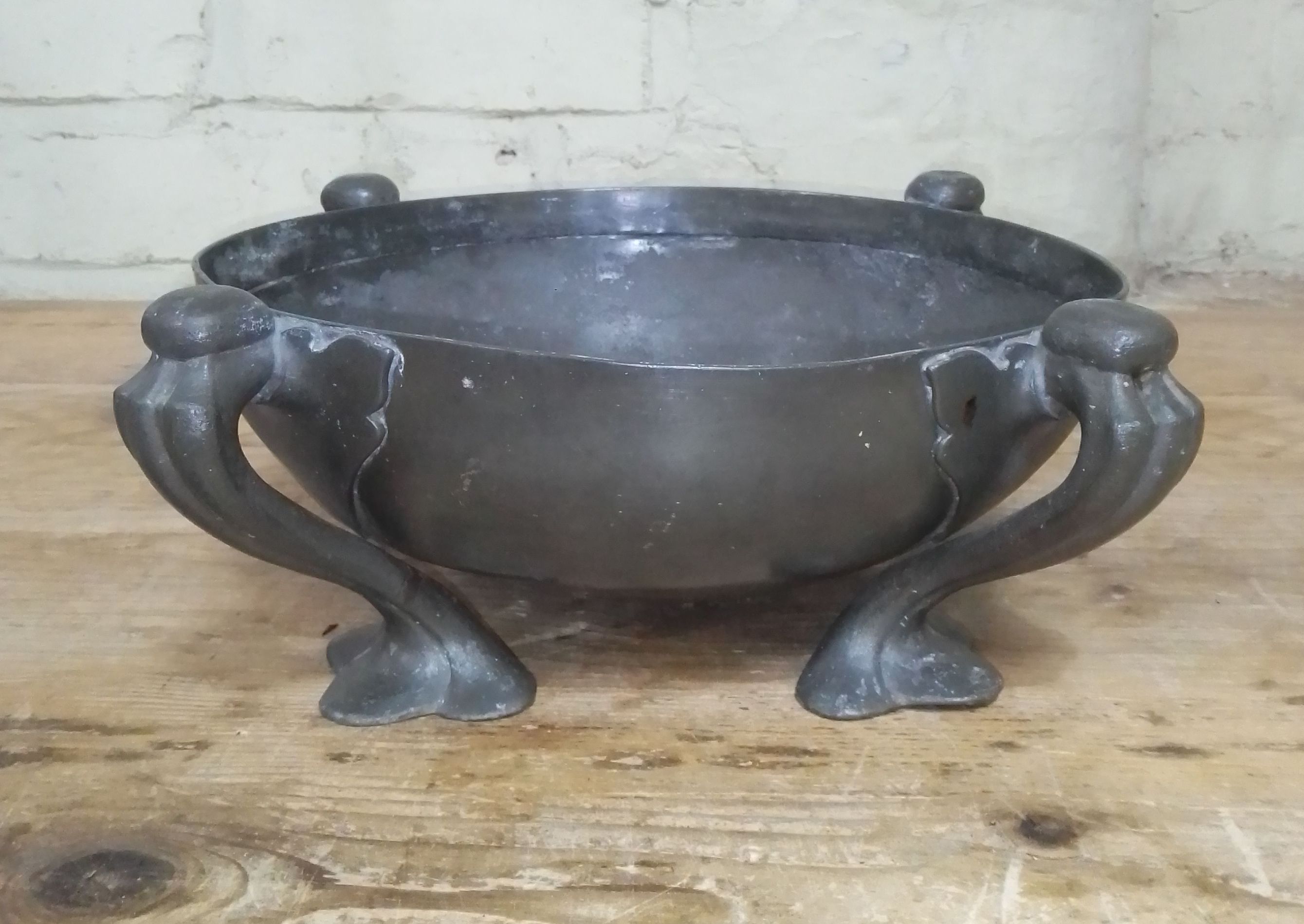 An Arts & Crafts Tudric pewter bowl designed by Oliver Baker for Liberty & Co, number 067,