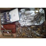 A box of assorted metal ware including Chinese white metal spoons, watch straps, silver etc.
