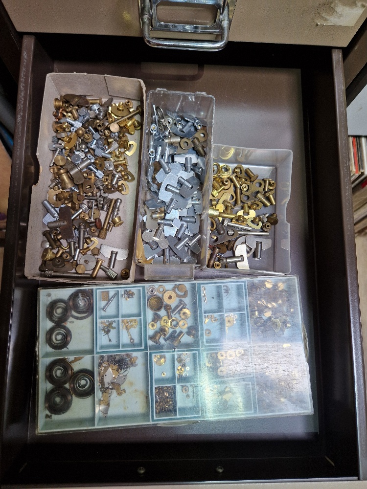 A 15 drawer triumph metal cabinet and contents comprising of clock making spares. - Image 11 of 16