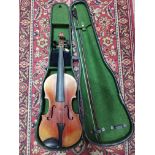 A late 19th century violin, two piece back, length 360mm, with bow and hard case.