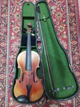 A late 19th century violin, two piece back, length 360mm, with bow and hard case.