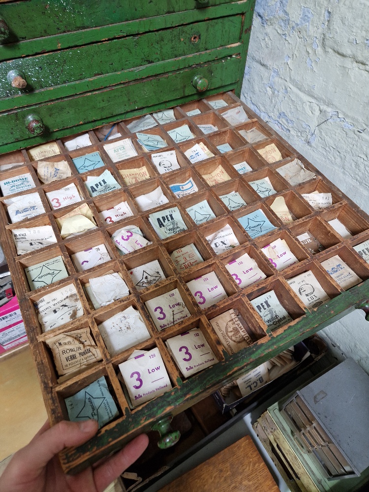 A large green horologist's chest and contents comprising watch and clock making spares. - Image 8 of 12