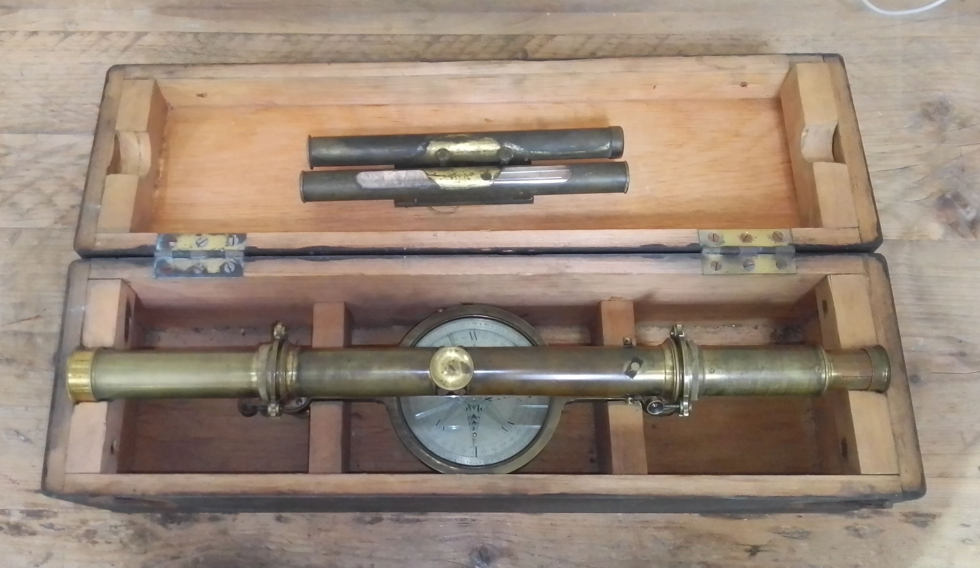 A brass surveyor's level by Troughton, fitted in painted pine box.
