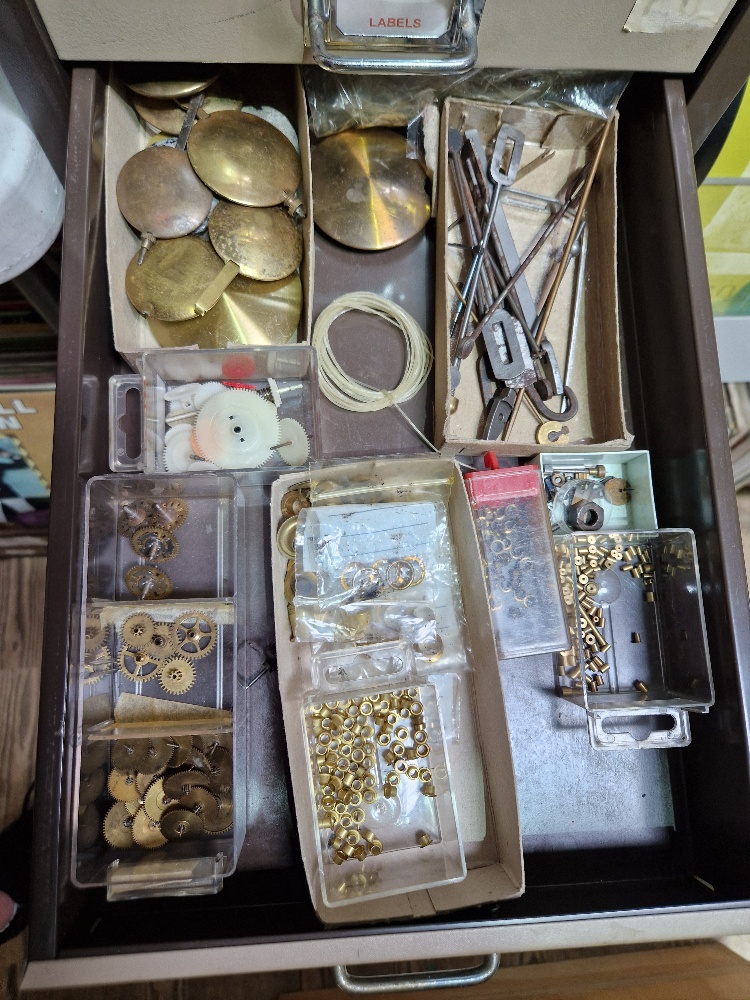 A 15 drawer triumph metal cabinet and contents comprising of clock making spares. - Image 7 of 16