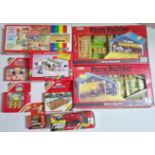 A group of Britains diecast models & accessories comprising of a 4710 Milking Parlour, 4160 Sheep