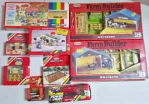 A group of Britains diecast models & accessories comprising of a 4710 Milking Parlour, 4160 Sheep