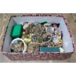 A box of assorted costume jewellery.