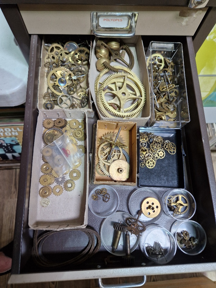 A 15 drawer triumph metal cabinet and contents comprising of clock making spares. - Image 6 of 16