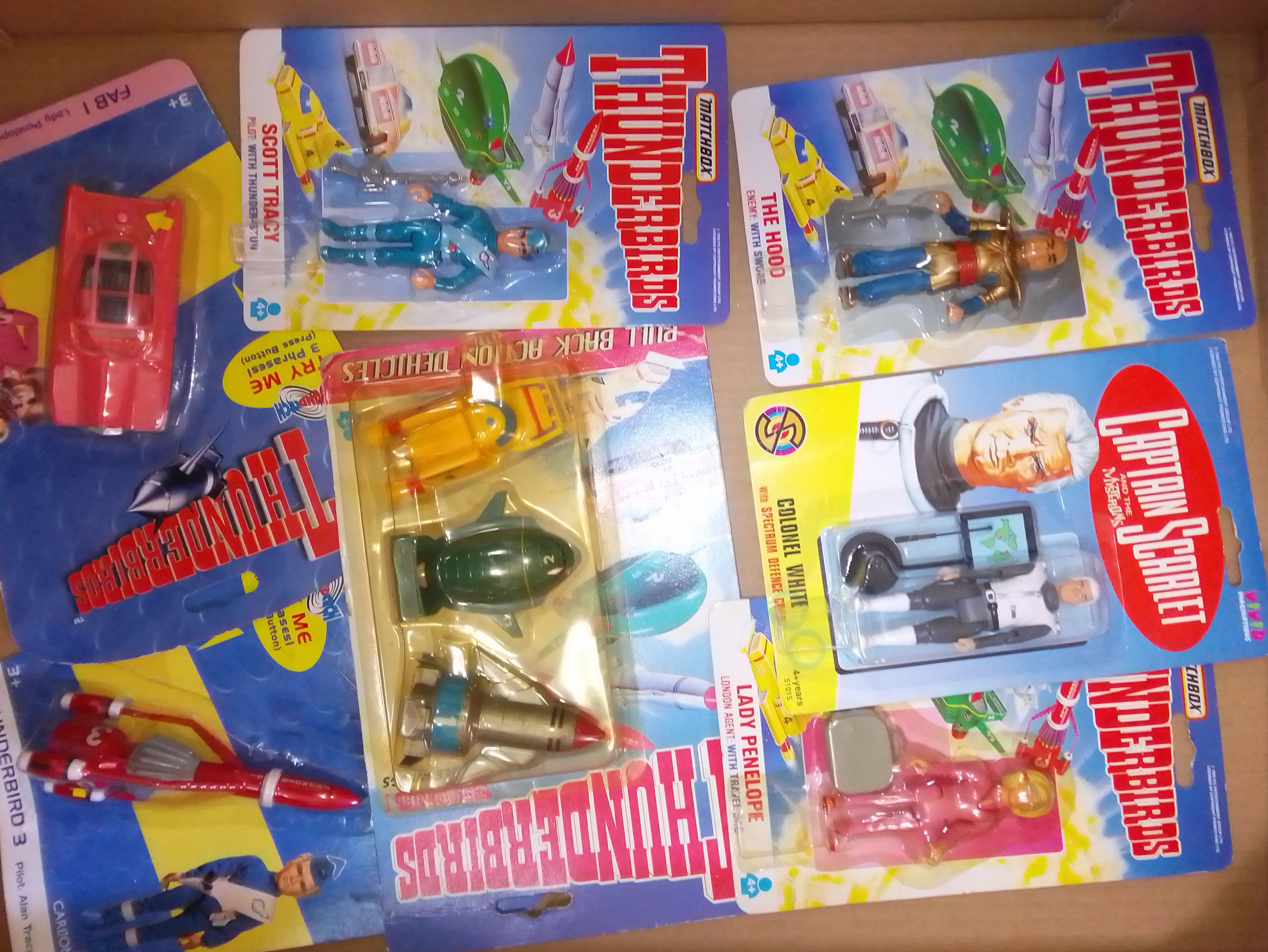 A box of unopened Thunderbird toys on card.