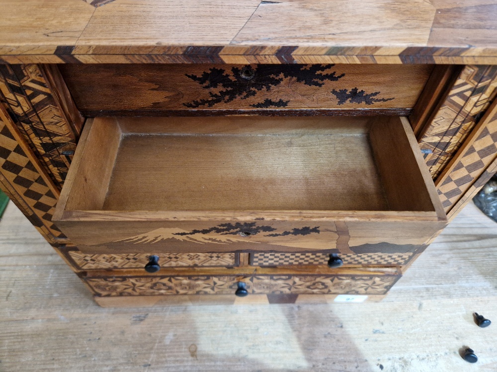 A Japanese parquetry inlaid miniautre cabinet. - Image 8 of 13