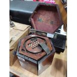 A Victorian concertina squeeze box, the mahogany case marked 'G F Wilson, London', together with a