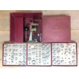 An Omega watch glass press, boxed with assorted dies.
