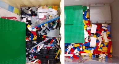 Two boxes of loose Lego with various instruction manuals.
